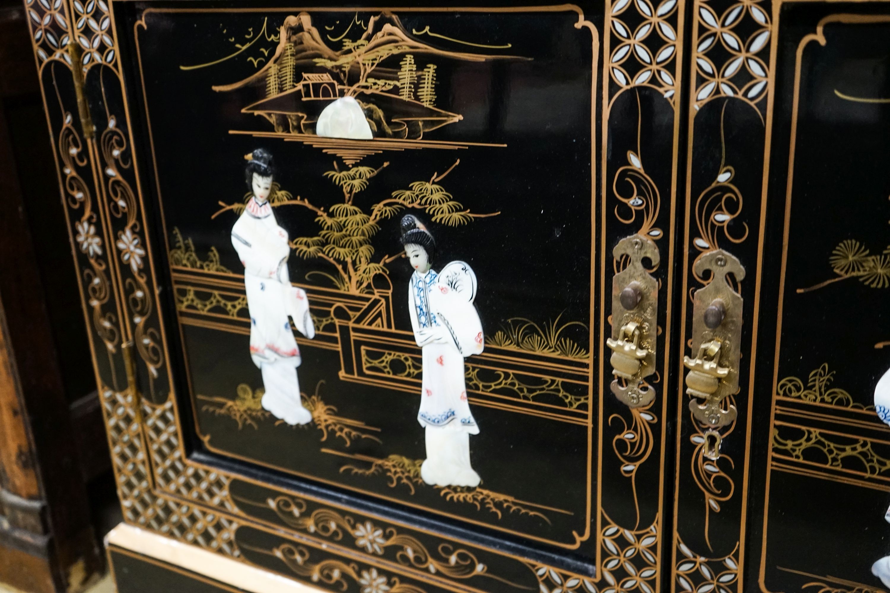 A Chinese style chinoiserie lacquer display cabinet with faux hardstone decoration, width 95cm, depth 38cm, height 183cm